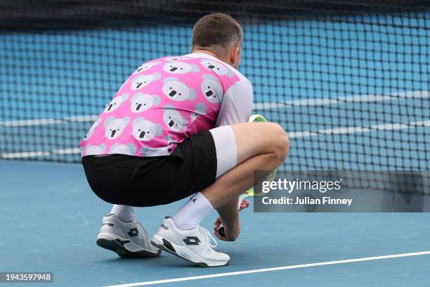 Ariel Behar of Uruguay competes in his round two doubles match with Adam Pavlasek of the Czech Republic against Jamie Murray of Great Britain and...