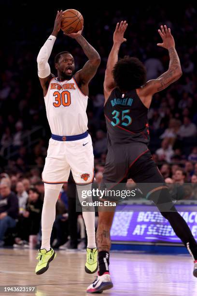 Julius Randle of the New York Knicks shoots a three point shot as Marvin Bagley III of the Washington Wizards defends at Madison Square Garden on...
