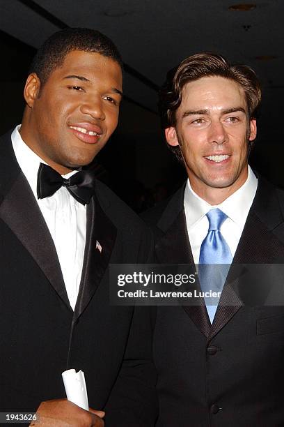 Giants team members Michael Strahan and Jason Sehorn arrive at the 24th Annual Sports Emmy Awards at the Marriott Marquis April 21, 2003 in New York...