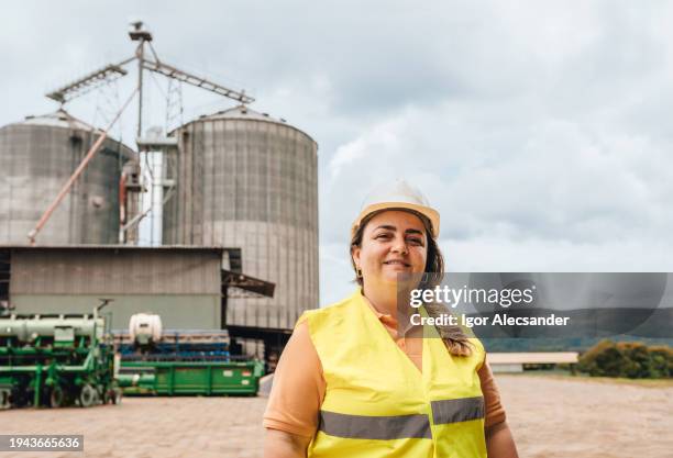 woman engineer in the agricultural industry - agricultural equipment stock pictures, royalty-free photos & images