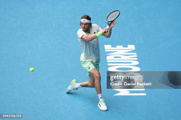 Stefanos Tsitsipas of Greece plays a backhand in their round three singles match against Luca Van Assche of France during the 2024 Australian Open at...