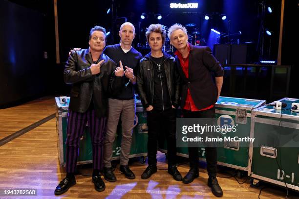 Tré Cool, Jeff Regan, Billie Joe Armstrong, and Mike Dirnt pose as Green Day performs for SiriusXM's Small Stage Series at Irving Plaza on January...