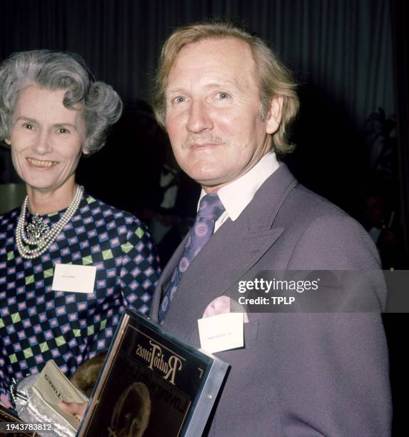 English actor Leslie Phillips poses for a portrait with his Radio Times award in London, England, September 28, 1973.