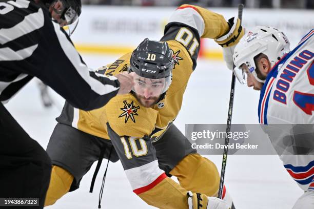 Nicolas Roy of the Vegas Golden Knights faces off against Nick Bonino of the New York Rangers during the first period at T-Mobile Arena on January...