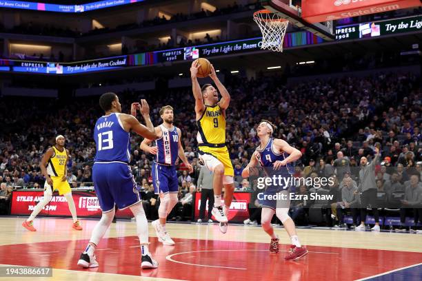 McConnell of the Indiana Pacers is guarded by Kevin Huerter of the Sacramento Kings in the first half at Golden 1 Center on January 18, 2024 in...