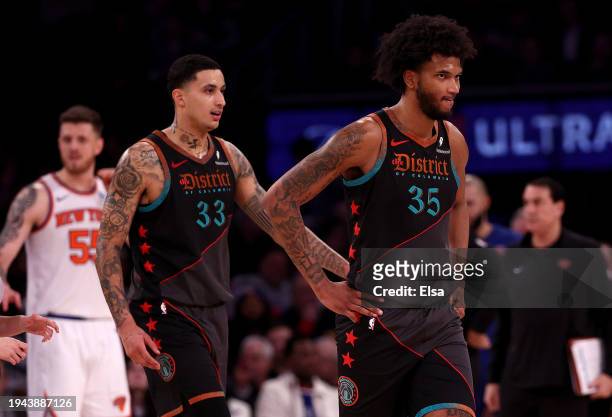 Marvin Bagley III and Kyle Kuzma of the Washington Wizards react as they head into a time out in the fourth quarter against the New York Knicks at...