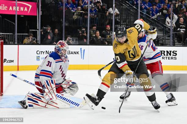Nicolas Roy of the Vegas Golden Knights looks to shoot on goaltender Igor Shesterkin and Erik Gustafsson of the New York Rangers in the second period...