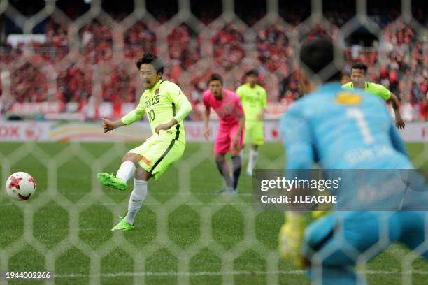 Shinzo Koroki of Urawa Red Diamonds converts the penalty to score the team's first goal during the Fuji Xerox Super Cup match between Kashima Antlers...