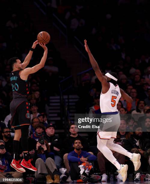 Landry Shamet of the Washington Wizards takes a shot as Precious Achiuwa of the New York Knicks defends at Madison Square Garden on January 18, 2024...