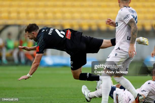 Timothy Payne of the Phoenix is tackled during the A-League Men round 13 match between Wellington Phoenix and Melbourne Victory at Sky Stadium, on...