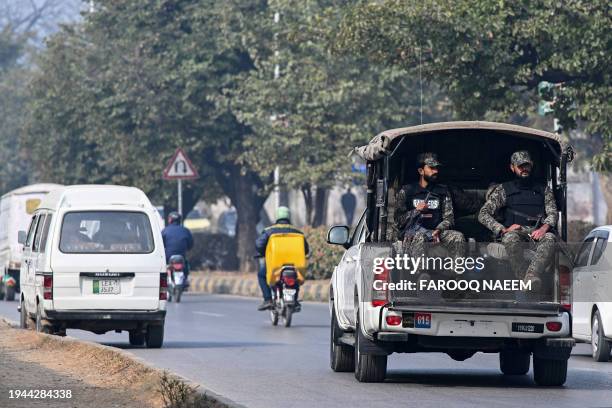 Paramilitary personnel patrolling a street ride a vehicle in Islamabad on January 22, 2024. Three universities affiliated with Pakistan's military...