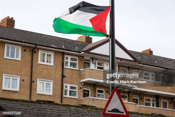 Palestinian flag is pictured flying from a lamp post in Tower Hamlets on 21st January 2024 in London, United Kingdom. There are many visible symbols...
