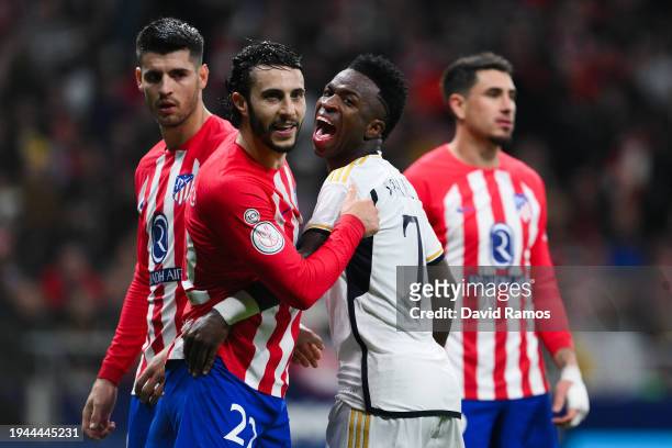 Vinicius Jr. Of Real Madrid CF argues with Mario Hermoso of Atletico de Madrid during the Copa del Rey Round of 16 match between Atletico Madrid and...