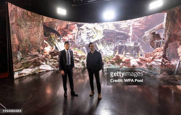 Prime Minister Rishi Sunak stands with graduate student Cody Updegrave in front of a digital image back drop projected onto a "Virtual production...