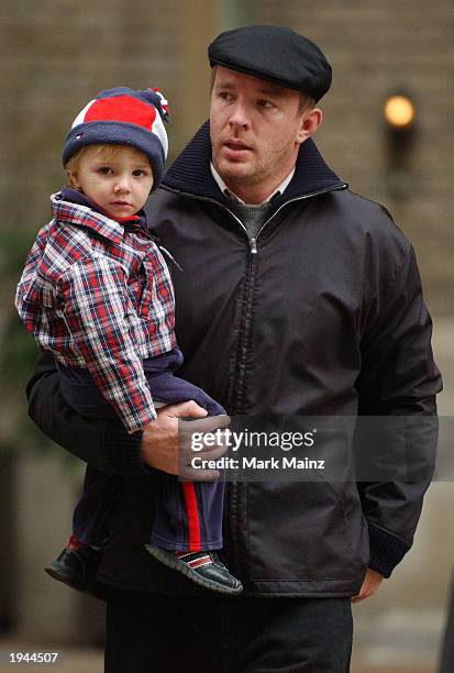 Director Guy Ritchie and his son Rocco leave their midtown apartment April 22, 2003 in New York City.