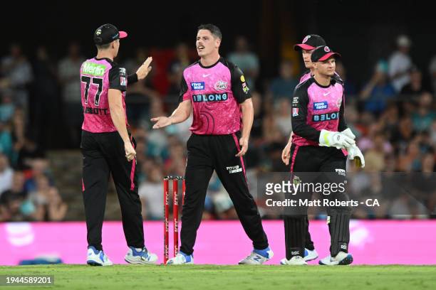 Ben Dwarshuis of the Sixers celebrates the wicket of Josh Brown of the Heat during the Qualifier BBL Finals match between Brisbane Heat and Sydney...