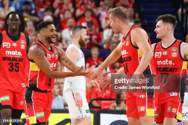 Corey Webster of the Wildcats and Jesse Wagstaff of the Wildcats high five after a play during the round 16 NBL match between Perth Wildcats and...