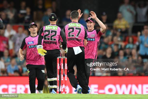 Ben Dwarshuis of the Sixers celebrates the wicket of Paul Walter of the Heat during the Qualifier BBL Finals match between Brisbane Heat and Sydney...