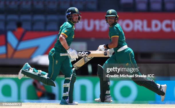 Dewan Marais and Juan James of South Africa run between the wickets during the ICC U19 Men's Cricket World Cup South Africa 2024 match between South...