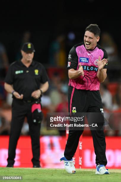 Ben Dwarshuis of the Sixers celebrates the wicket of Matthew Kuhnemann of the Heat during the Qualifier BBL Finals match between Brisbane Heat and...