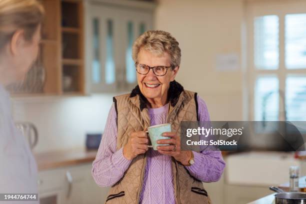 tea break in the kitchen - day in the life series stock pictures, royalty-free photos & images