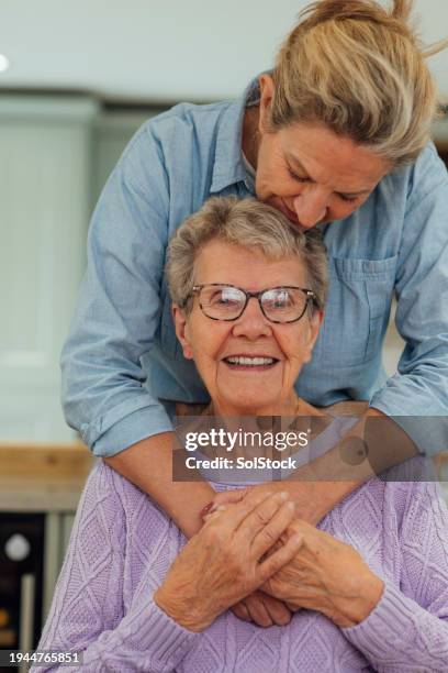 an embrace of love - demens bildbanksfoton och bilder