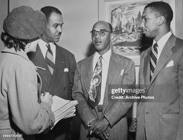 American civil rights activist Roy Wilkins, Acting Secretary of the NAACP, American civil rights activist Heman Marion Sweatt, and American lawyer...