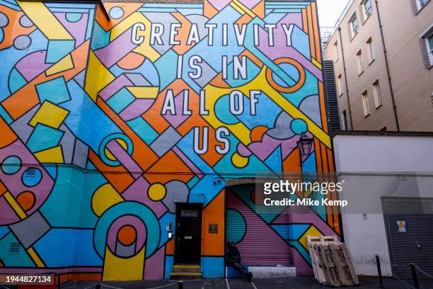 Large scale patterned mural outside the London Graphic Centre in Covent Garden reads Creativity Is In All Of Us on 19th January 2024 in London,...