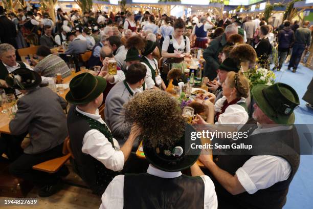 Participants wearing Bavarian folk dre crowd the Bavaria hall at the Green Week agricultural trade fair on its opening day on January 19, 2024 in...