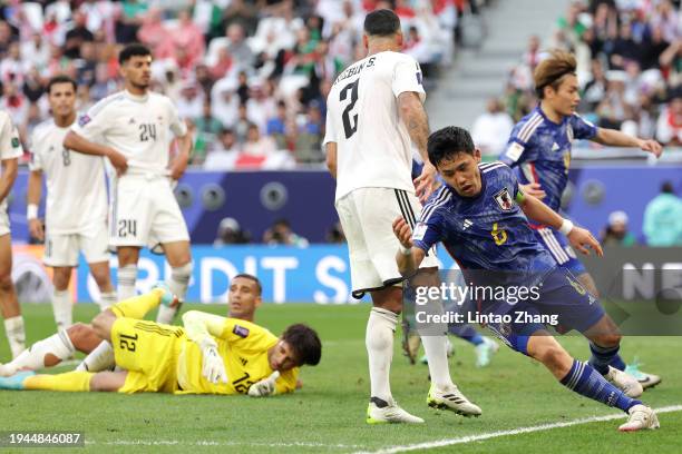 Wataru Endo of Japan celebrates scoring his team's first goal during the AFC Asian Cup Group D match between Iraq and Japan at Education City Stadium...