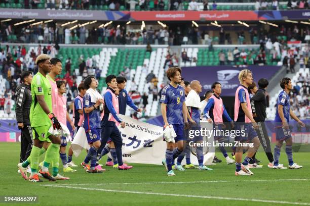Players of Japan look dejected after the team's defeat in the AFC Asian Cup Group D match between Iraq and Japan at Education City Stadium on January...