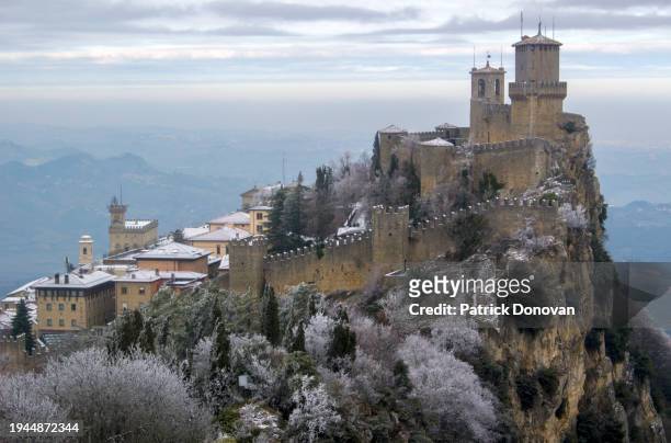 winter view of the first tower (guaita) in san marino - patrick fort stock pictures, royalty-free photos & images