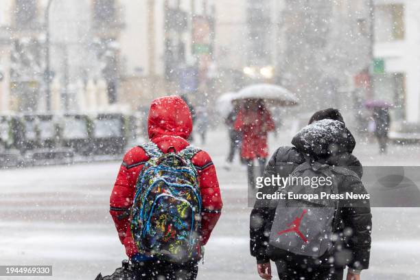 Two children walk in the snow on January 19 in Soria, Castilla y Leon, Spain. The passage of the squall Juan has brought with it important snowfalls...