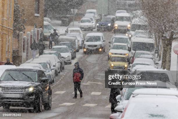Several cars drive while it snows, on 19 January, 2024 in Soria, Castilla y Leon, Spain. The passage of the squall Juan has brought with it important...