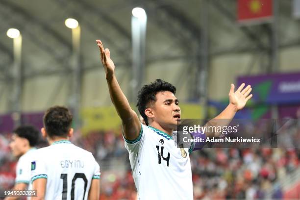 Asnawi Mangkualam of Indonesia celebrates scoring his team's first goal during the AFC Asian Cup Group D match between Vietnam and Indonesia at...