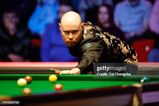 Gary Wilson of England plays a shot in the quarterfinal match against Ronnie O'Sullivan of England on day 5 of the 2024 Spreadex World Grand Prix at...