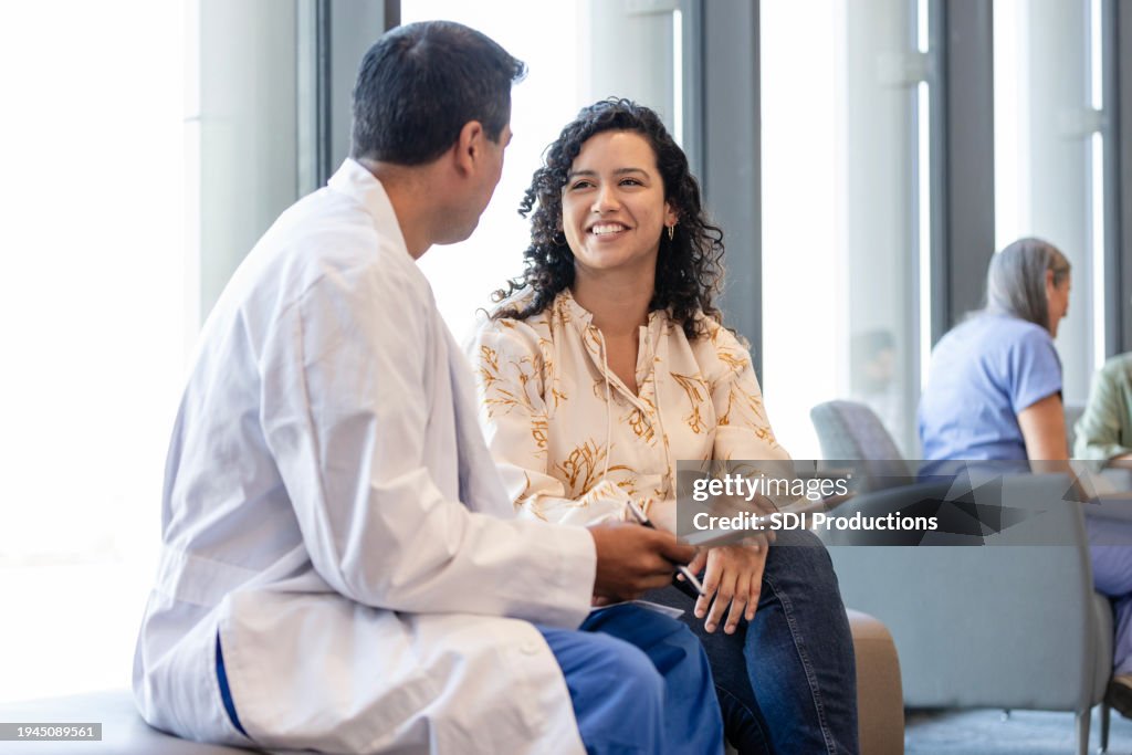Female family member gets good news from male surgeon