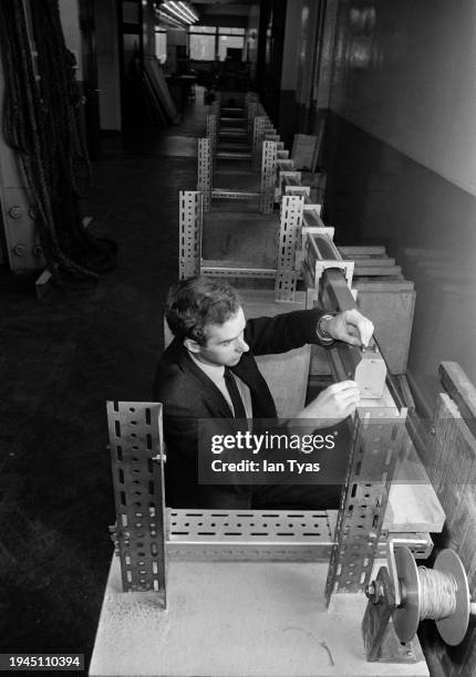 Dr David Henson during a demonstration of a train moving along a model of the Channel Tunnel railway at Leeds University's Department of Civil...