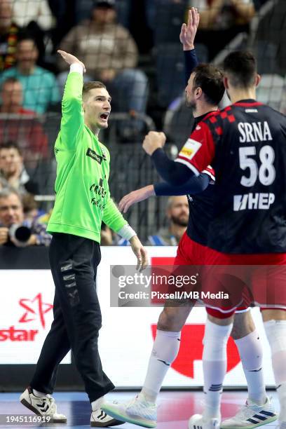 Dominik Kuzmanovic of Croatia and Domagoj Duvnjak of Croatia during the Men's EHF Euro 2024 main round match between Croatia and Iceland at Lanxess...