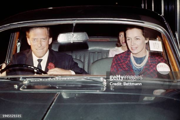 George Lascelles, 7th Earl of Harewood , at the wheel of his Jaguar, with his wife Patricia in the passenger seat, London, August 1st 1967. Lord...