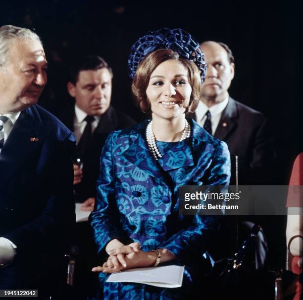 Empress Farah Pahlavi, wife of the Shah of Iran, attending a fashion show at the Hilton Hotel in Berlin, June 2nd 1967. At left is Heinz Mohr,...