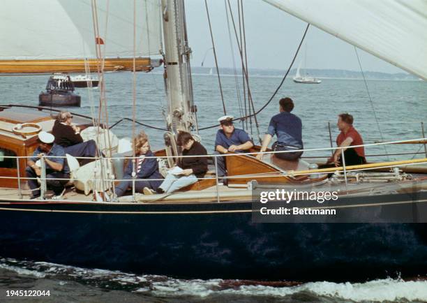 Princess Anne sits next to Anthony, Lord Burghersh, on the yacht Bloodhound at Cowes, Isle of Wight, August 1st 1967. They are sitting against the...