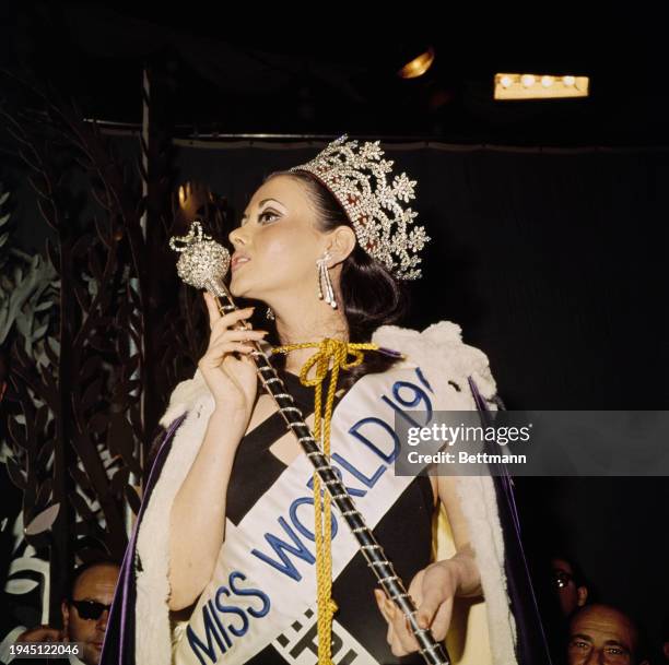 Winner of the 1967 Miss World beauty pageant, Madeline Hartog-Bel of Peru , holding her sceptre and wearing her sash and crown at the Lyceum Ballroom...