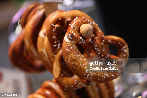 Pretzels hang on display at the Green Week agricultural trade fair on its opening day on January 19, 2024 in Berlin, Germany. The fair runs from...