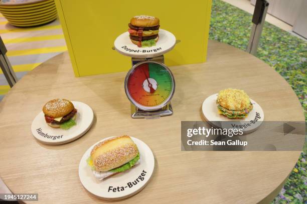 Display illustrates the climate impact of burger variations, including beef, feta and veggie, at the stand of Germany's Federal Ministry of Food and...