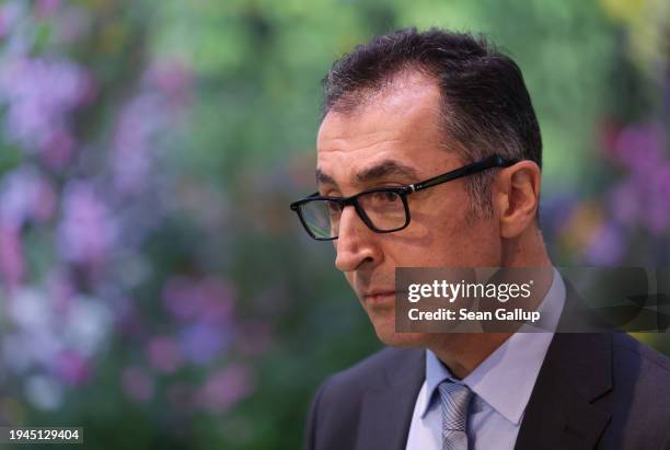 German Federal Agriculture Minister Cem Oezdemir speaks to journalists while touring the Green Week agricultural trade fair on its opening day on...