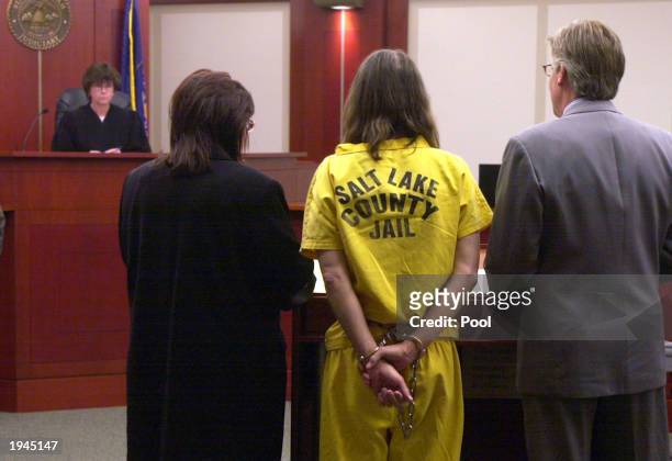 Brian David Mitchell , dressed in prison clothing, appears before Judge Judith Atherton with his lawyers, David Biggs and Kimberly Clark , while in...