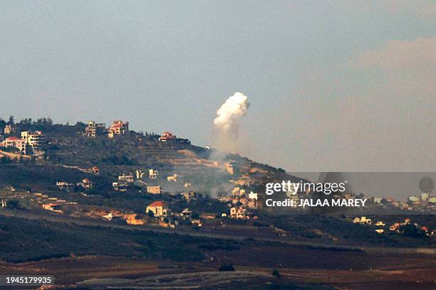 This picture taken from an Israeli position along the border with southern Lebanon shows smoke billowing above the Lebanese village of Adaysseh...