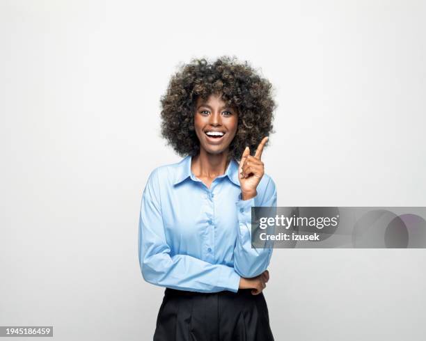 portrait of a happy young businesswoman - woman index finger stock pictures, royalty-free photos & images