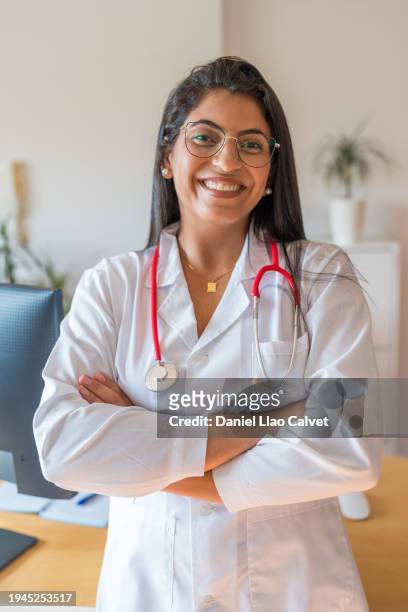 female doctor smiling and looking at camera - casa calvet stock pictures, royalty-free photos & images